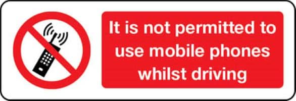 3502 It is not permitted to use mobile phones whilst driving sign