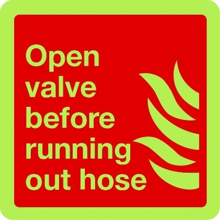 Open valve before running out hose sign