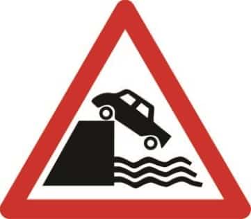 Quayside or river bank ahead triangle