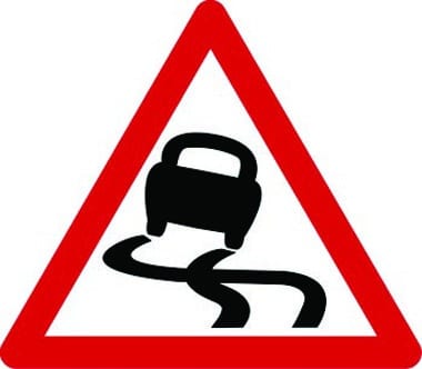 Slippery road ahead traffic sign