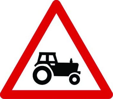 Agricultural vehicles likely ahead traffic sign