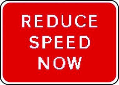 Reduce speed now traffic sign