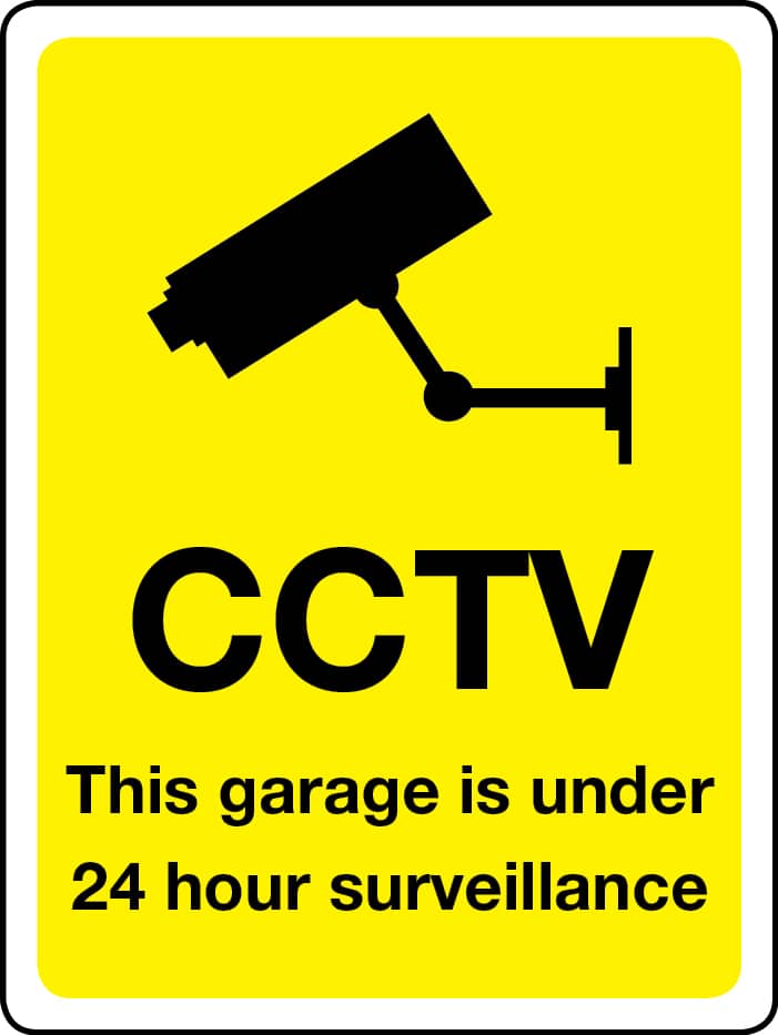 This garage is under 24-hour surveillance sign