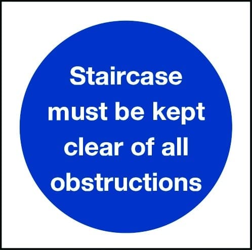 Staircase must be kept clear of obstructions sign