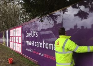 Stocksigns installing Hoarding Panels