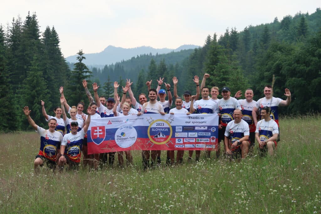 Slovakia Summits 2023 - The crew pose with the Charity banner