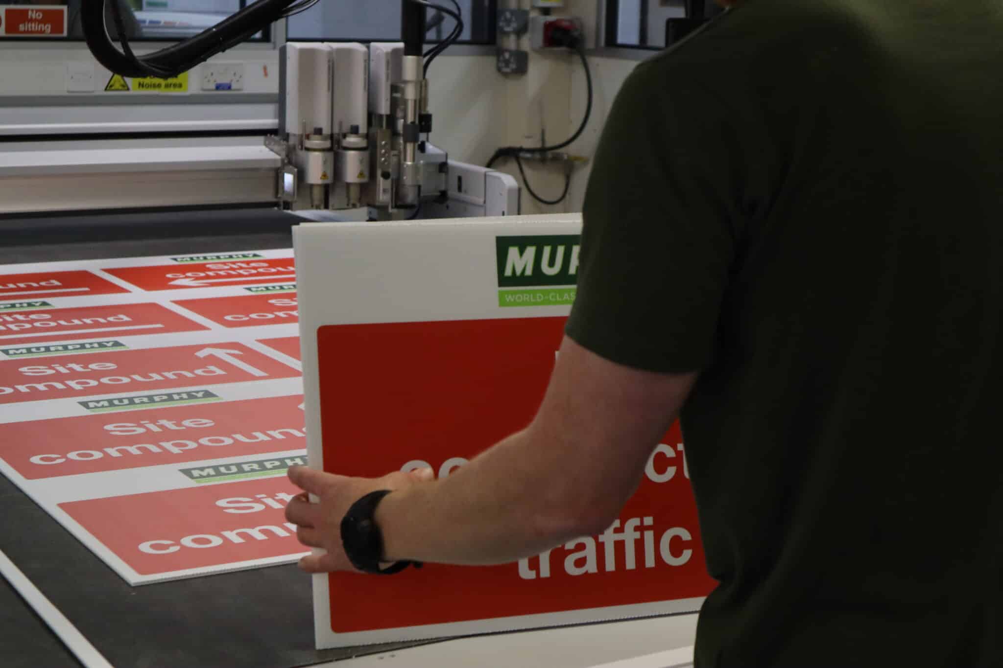 The Zund Cutter cutting up correx signs